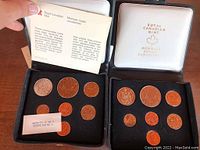 Two opened black display cases each holding seven Canadian coins from the years 1978 and 1979, plus a descriptive card from Royal Canadian Mint.