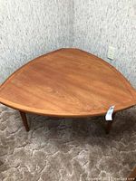 Top-down view of the triangular coffee table in corner