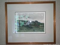 Framed and matted watercolor landscape depicting a house with surrounding greenery and hills.