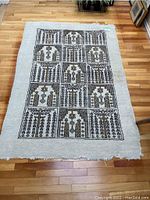 Full view of 4x6 area rug laid out on hardwood floor showing overall design and size.