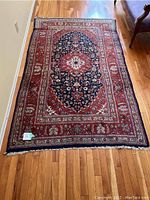 Full view of area rug on hardwood floor