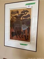 Full view of the framed artwork showing the full abstract composition in warm brown tones and thin dark frame.