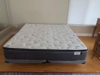 Front view of king size mattress on base showing size and condition