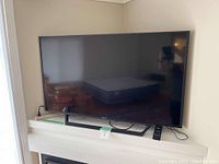 Front view of TV on console