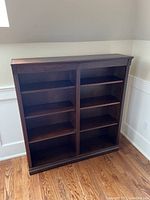 Front view of the Stoney Creek wood book case with shelves visible and an overall rectangular frame.
