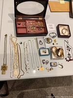 Flat-lay overview of entire jewelry assortment on table