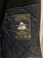 Close-up of the interior label showing the original Pischl fabric, indicating natural water-repellent loden cloth.