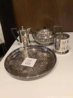 Silverplate tray with tea set items displayed showing overall condition and designs