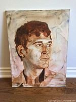 Full view of the portrait art on canvas showing the entire painting and signature area.