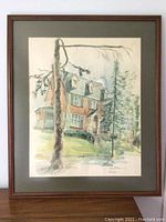 Full view of the framed watercolor painting showing a house and surrounding trees with a visible signature and date.