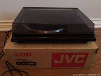 JVC turntable on original JVC box with dust cover closed