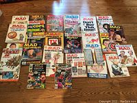 All 19 publications arranged on floor