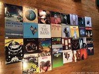 Overview of 25 rock LP covers laid on floor