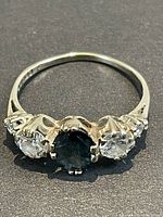 Top-down view of ring showing central sapphire and flanking diamonds