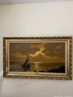 Full view of framed oil painting showing sailboat on water under a cloudy sky