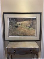 Full view of framed print above console table