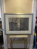 Front view of framed print showing entire artwork, mat, frame and wall context