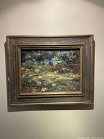 Overall front view of oil painting and frame hung on wall