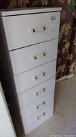 Front view of the small 6 drawer off-white lingerie chest showing all drawers and handles.