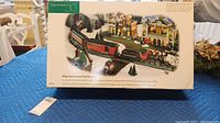 Box top showing Department 56 Village Express Electric Train Set with winter village scene illustration