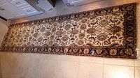 Full view of runner on tile floor