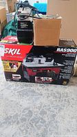 Skil Router Table box with some other boxed items on top.