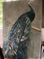Full view of the original peacock painting on fabric-covered board, showing vibrant colors and texture.
