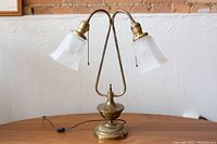 Full view of lamp showing base, gooseneck arms and shades