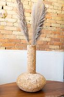 Photo of the cork style vase with pampas grass showing full view and texture