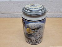 Front view showing the detailed painted bald eagle image with the word 'BALD EAGLE' on the ceramic stein.
