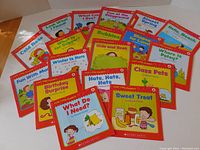 Photo of all 20 Scholastic First Little Readers books laid flat to show cover artwork and titles