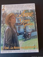 Front cover of Anne of Green Gables 5-disc DVD collector's edition showing young woman in period costume outdoors and horse carriage in background.