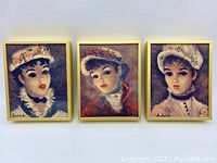 Three small portrait reproductions by Huldah in gold frames, depicting young ladies in turn-of-the-century fashion. All have a gold frame and are signed 'Huldah'.