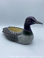 Side view of the ceramic loon planter showing detailed feather painting and realistic bird shape