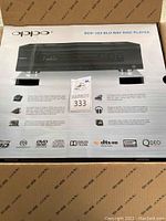 Top of OPPO BDP-105 Blu-ray Disc Player box showing unit image, logos and supported formats
