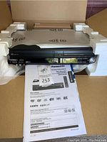 Front view of recorder in packaging with manual visible