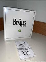 Front of box showing 'The Beatles in Mono' title and green apple artwork