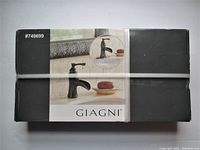 Original boxed Giagni faucet with product image and item number on packaging.