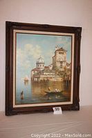 Frontal view of the framed oil painting depicting Venice canal scene, showing full frame and artwork condition.