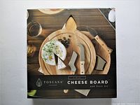 Box front showing Toscana Circo Cheese Board set with styled food presentation.