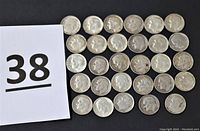 Lot of 29 U.S. silver dimes arranged in rows showing their obverse sides with Roosevelt profiles, alongside a card labeled '38' for lot identification.