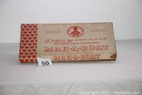 Full view of the MAK-A-BOAT toy box showing title and part of the condition of the box.