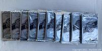 Ten sealed silver foil packs of 1992-93 Upper Deck hockey cards arranged horizontally.