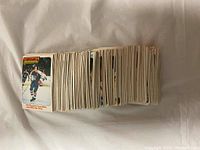 Front view showing stacked hockey cards featuring player images and team logos.