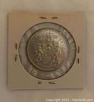 Front view of the coin showing Canadian coat of arms and denomination '50 CENTS'