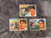 Fronts of three baseball cards showing players Dale Long, Wilm Rivera, and Tom Brewer with team uniforms and names