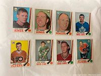 Front face view of the 8 hockey cards featuring player portraits and team information.