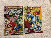 Front covers of Amazing Spider-Man comics #370 and #371 showing main artwork and condition