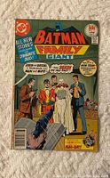 Front cover of Batman Family Giant #11 comic showing a wedding scene with characters in suits and dresses, priced at 50 cents, with DC Comics logo.