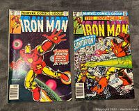 Front covers of Iron Man #142 and #143 showing vintage comic artwork and condition